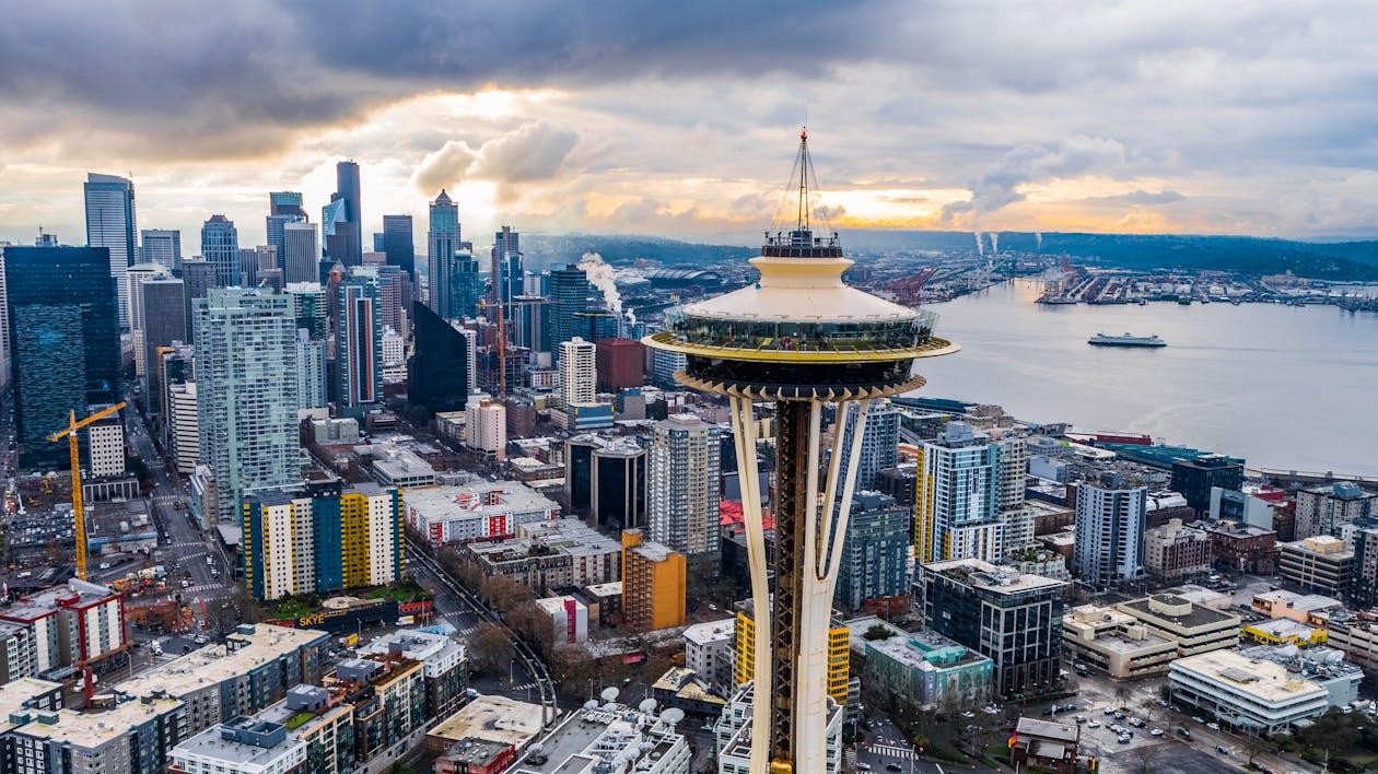 Free Stunning aerial shot of Seattle's skyline featuring the iconic Space Needle at sunset. Stock Photo